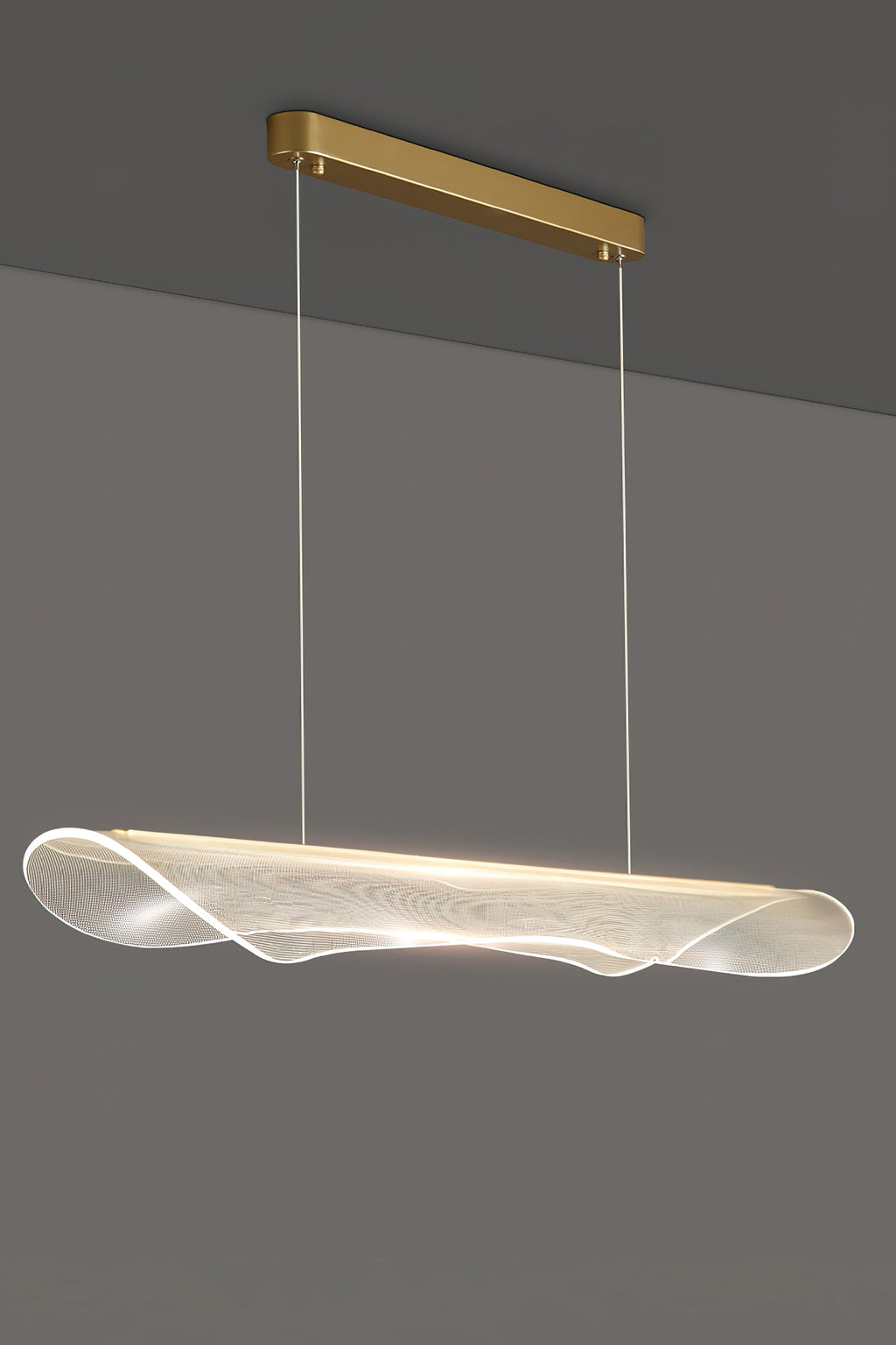 Clérachic pendant light with a rippled acrylic shade and a slim gold canopy hanging beside a darker ceiling line on a grey wall.