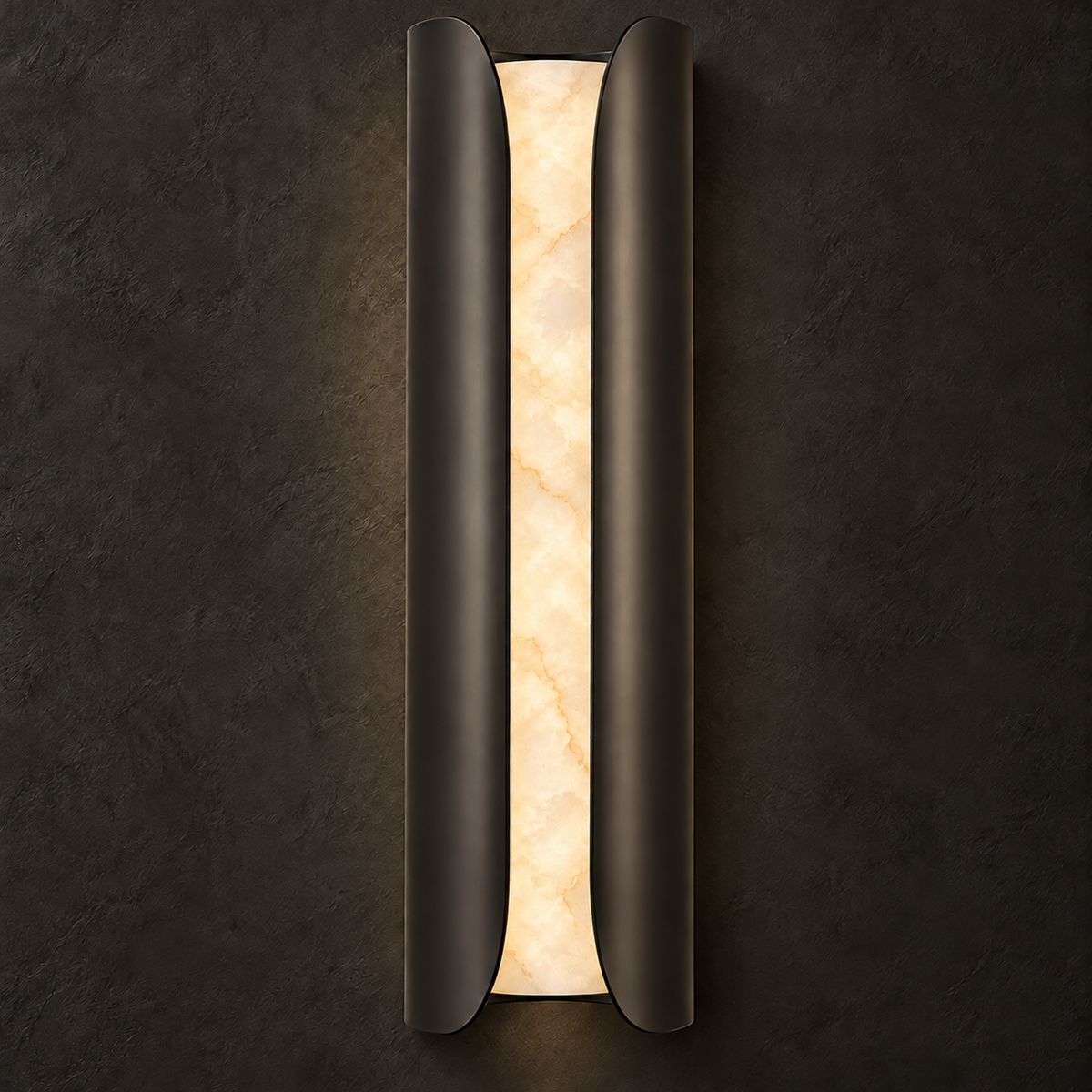Black Clérachic alabaster wall sconce lit on a dark textured wall, the veining in the stone showing gold and cream.