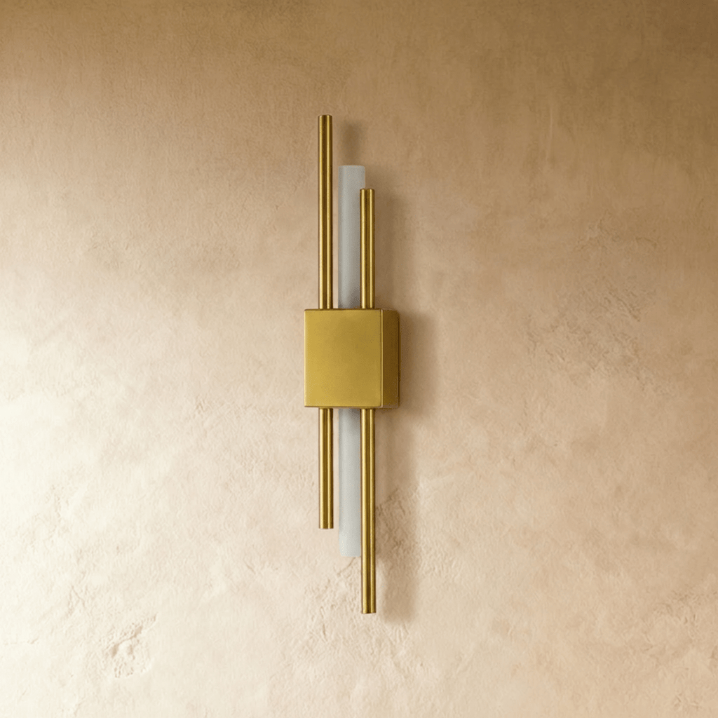 This gold-finish Clérachic wall light shows its square backplate and paired brass rods flanking the frosted acrylic strip.
