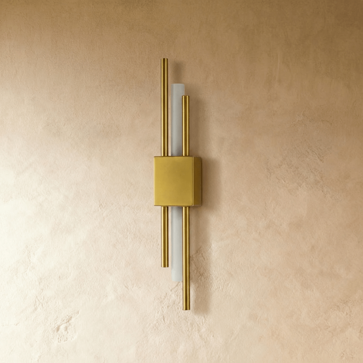 This gold-finish Clérachic wall light shows its square backplate and paired brass rods flanking the frosted acrylic strip.