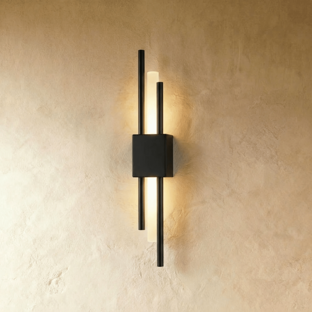 In matte black, this Clérachic wall sconce pairs slender rods with a glowing acrylic strip against a plastered wall.