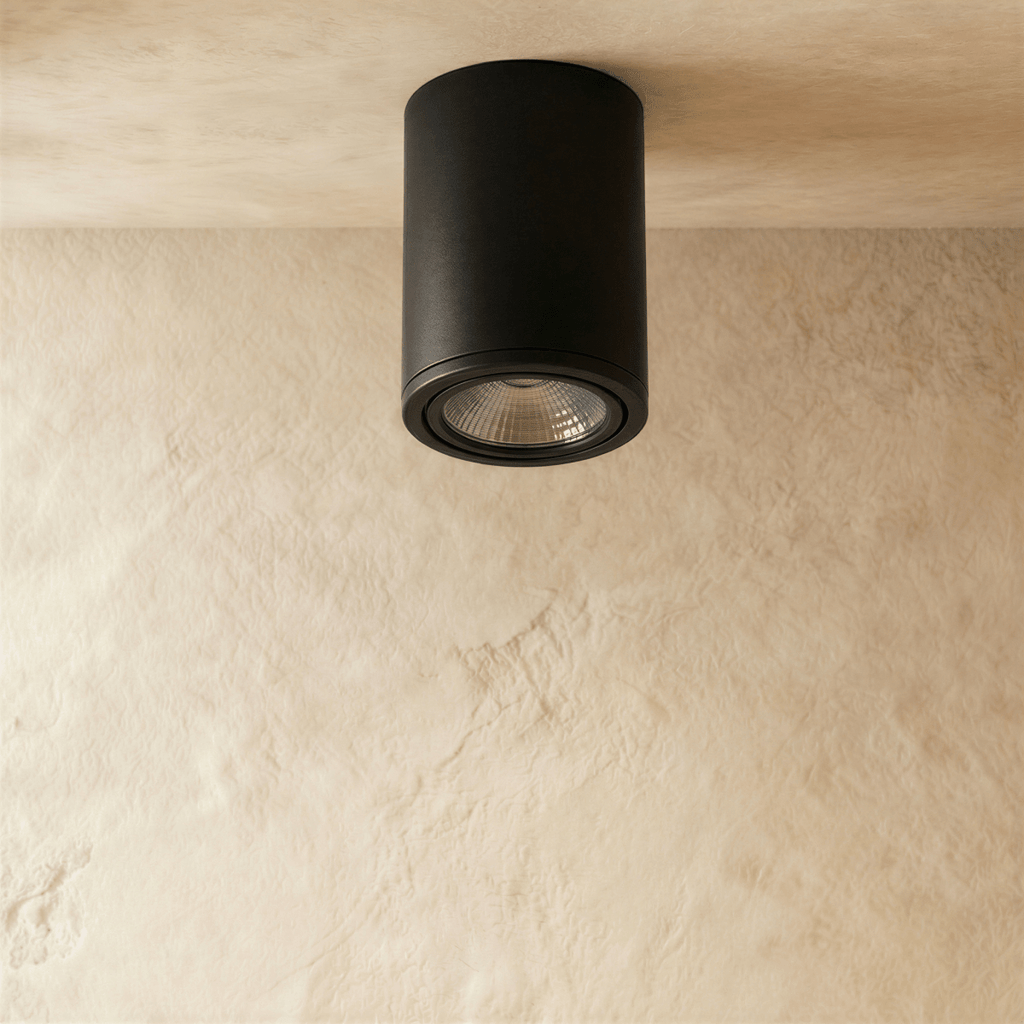 Clérachic black aluminium cylinder downlight, switched off, showing its ribbed reflector and slim trim ring on a ceiling.