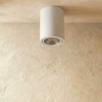 Clérachic white aluminium cylinder downlight, switched off, showing its ribbed reflector and slim trim ring on a ceiling.