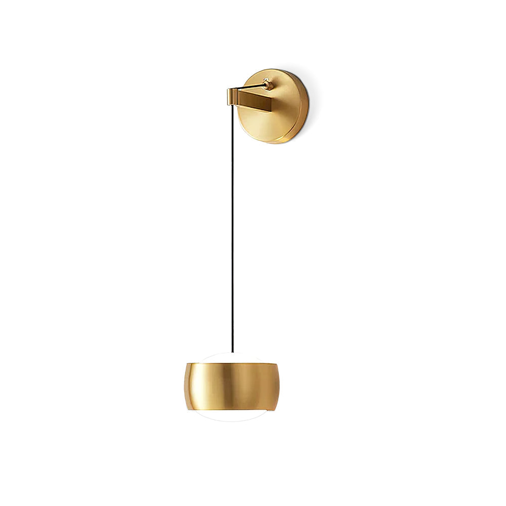 Brass Clérachic wall light on a white backdrop, shown full length with its cable, round backplate and small cylinder shade.