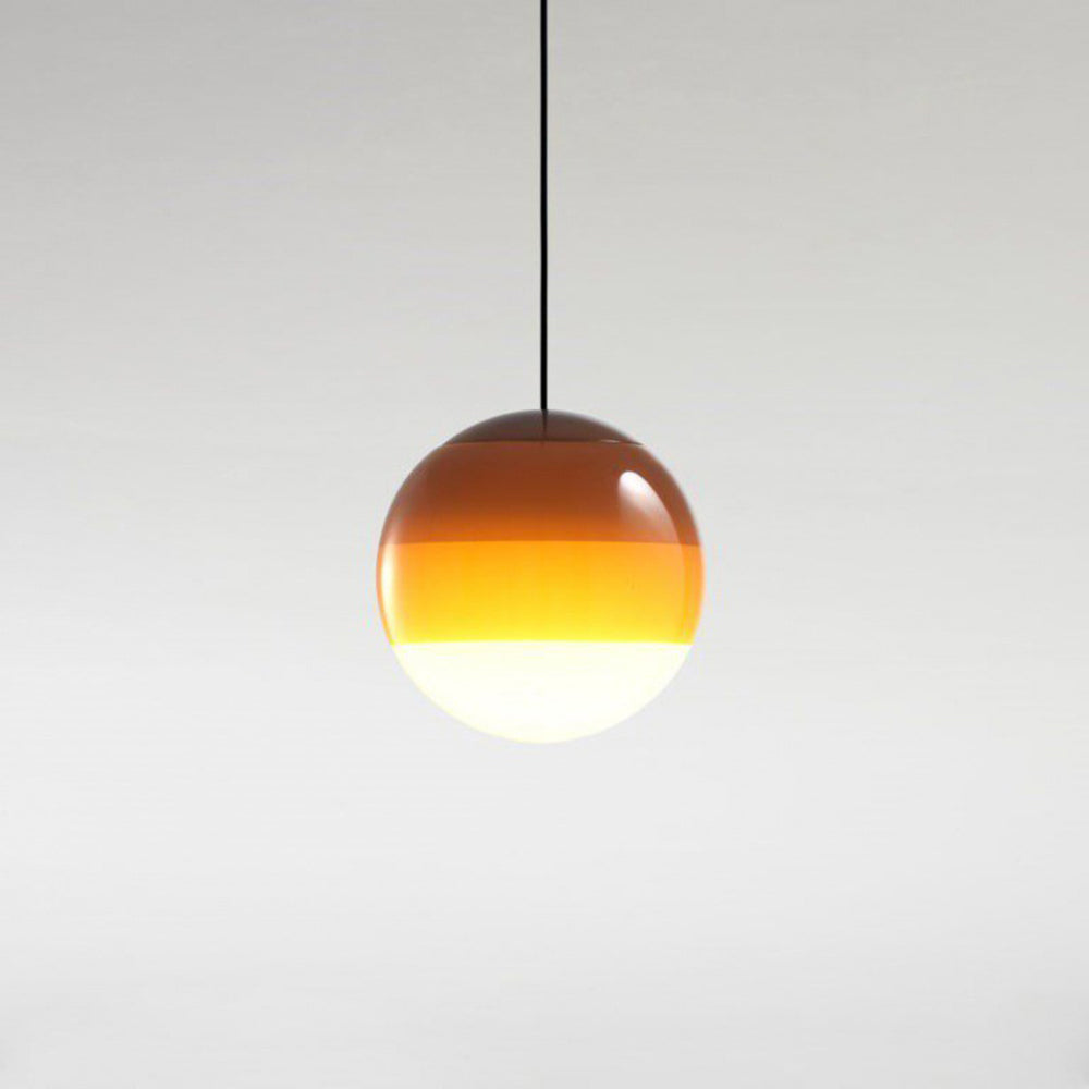 Clérachic dipped gradient glass pendant light in warm amber, the colour deepening from the opal white base up to the crown.