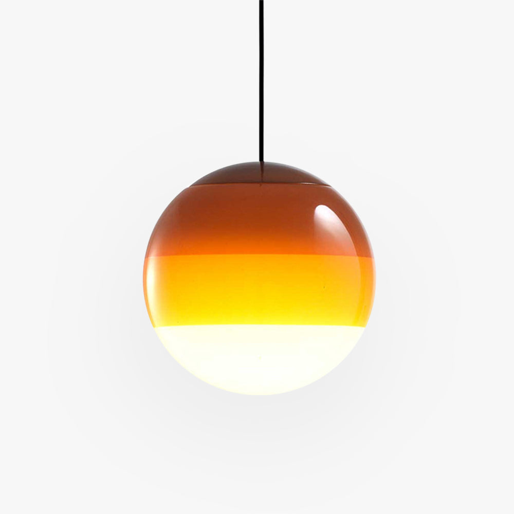 Studio shot of the Clérachic dipped gradient glass pendant light in amber, its crown deepening to burnt orange.