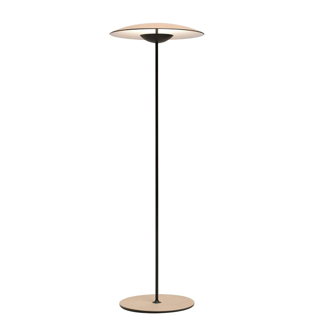 This Clérachic floor lamp on a plain white backdrop, with a wide disc shade on a slim black stem and a wood-grain base.