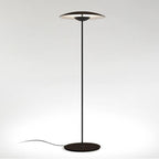 A matte black Clérachic floor lamp on a light grey backdrop, with a dark shade, black stem and round black base.