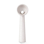 Pale grey-white Clérachic floor lamp with a textured finish and a bowl shade holding a round bulb, on white.