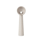 Clérachic floor lamp in a taupe-grey version, with a tall tapering stem and a round white bulb inside the bowl shade.
