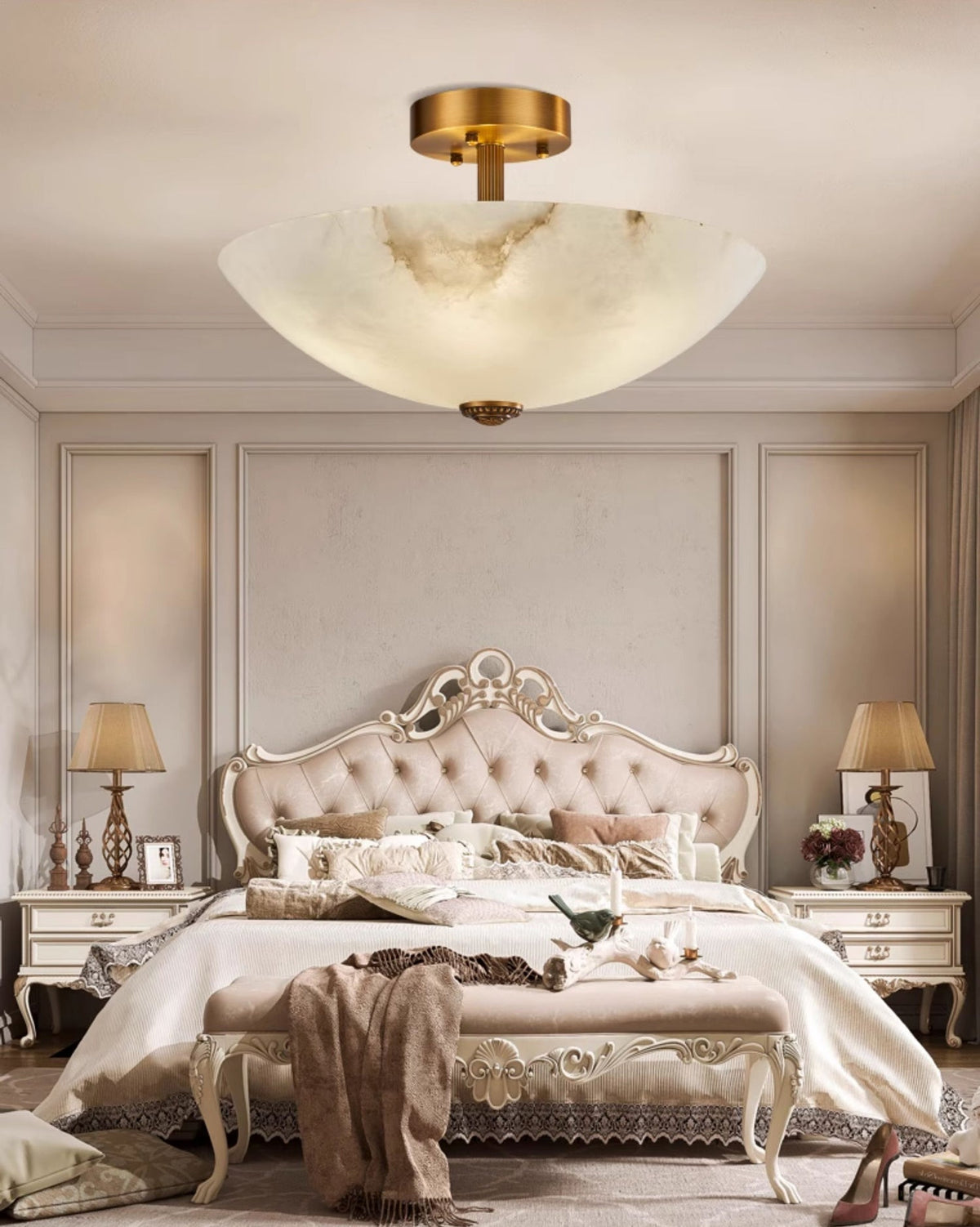 Full bedroom view with this Clérachic alabaster ceiling light centred over an ornate bed, a throw draped on the bench at its foot.