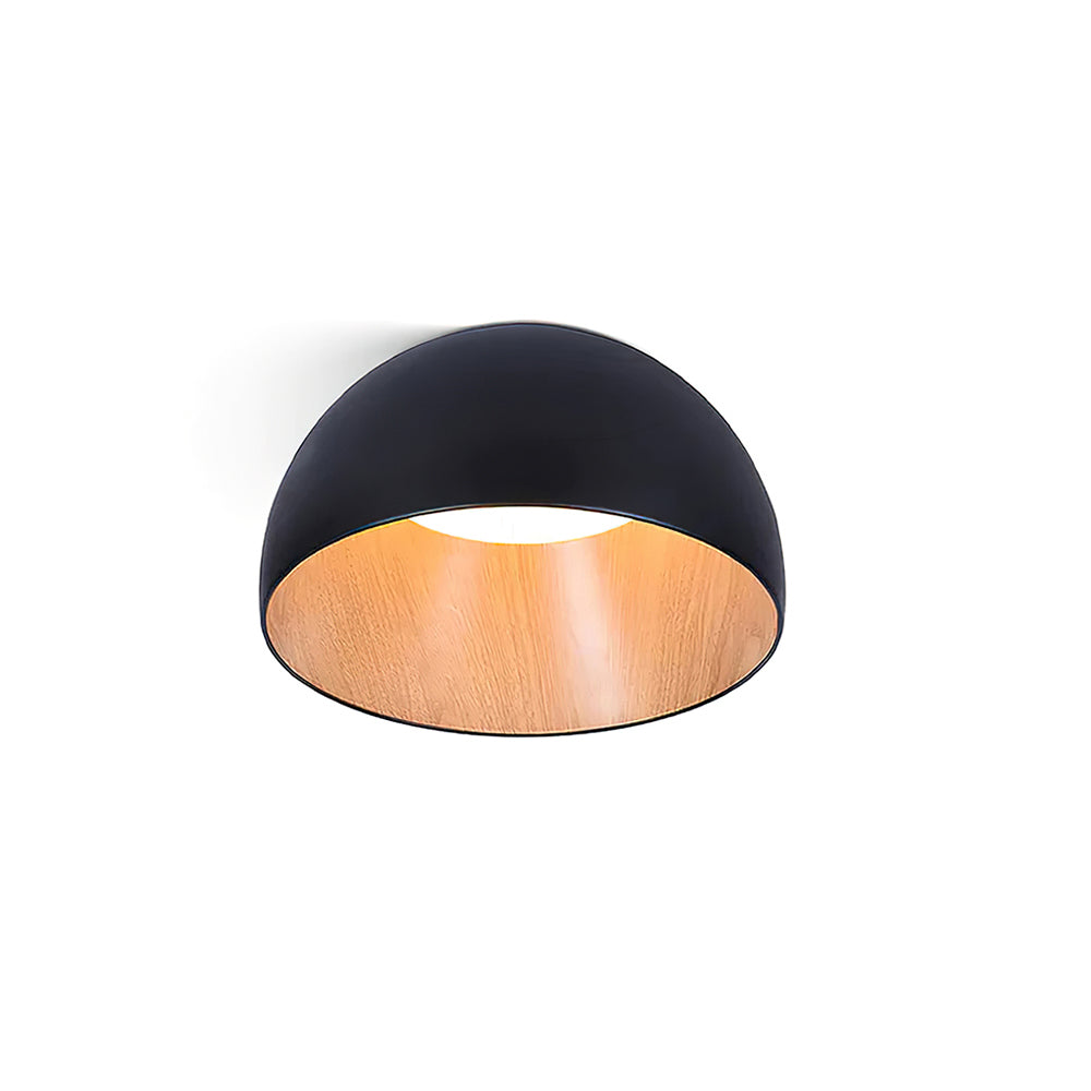 Black Clérachic dome ceiling light seen from below, with the oak-effect interior and a white light source, on a white backdrop.