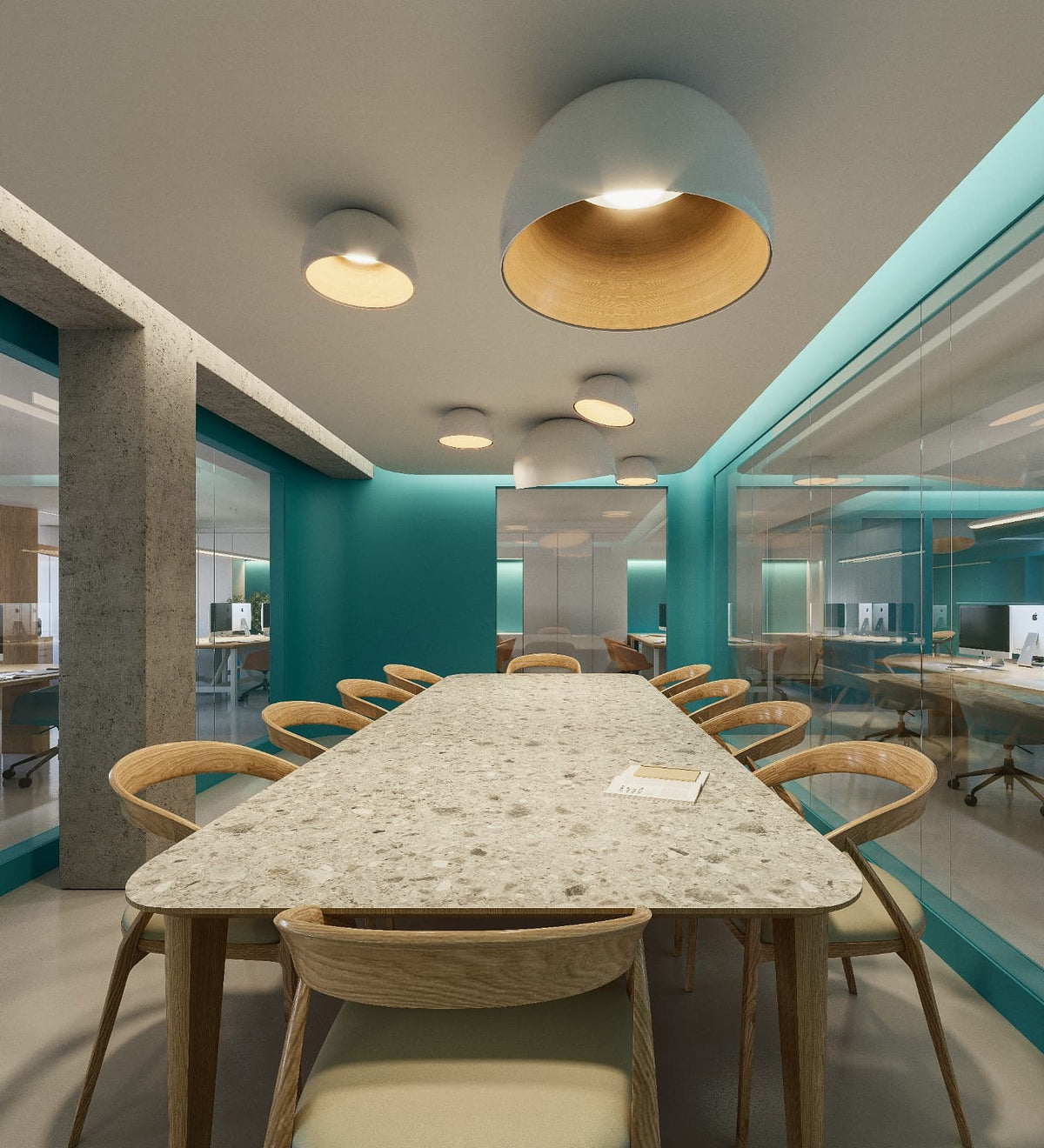 A large Clérachic dome ceiling light with an oak interior beside a smaller flush light, above a long stone table and a teal wall.