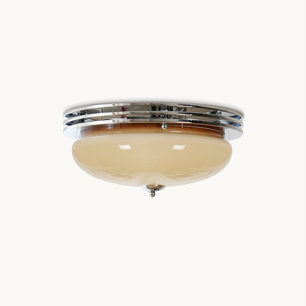 This Clérachic flush-mount ceiling light on a plain white background, with a beige glass dome under a triple chrome trim ring.