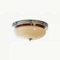 Chrome and beige Clérachic dome ceiling light with a small chrome finial, on a soft white background.