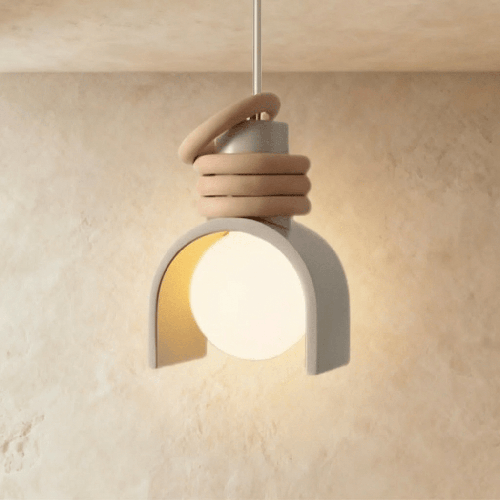 Clérachic pendant light in white, an arch-shaped shade partly around a glowing opal orb, stacked tan rings on top