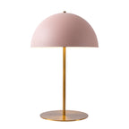 Pink dome table lamp from Clérachic with a brass stem and flat base, cut out on a clean white background.