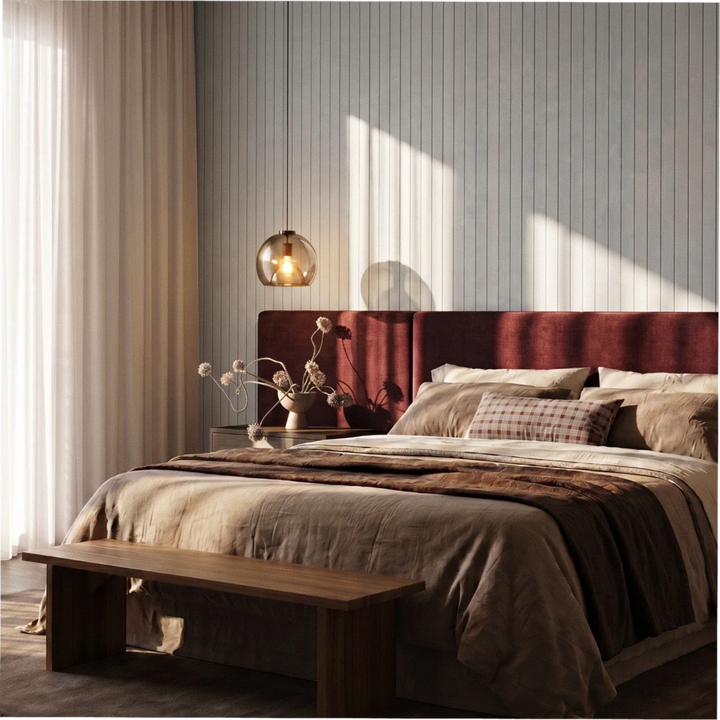 Clérachic smoked glass pendant glowing over a bedroom with a burgundy upholstered headboard and panelled wall.