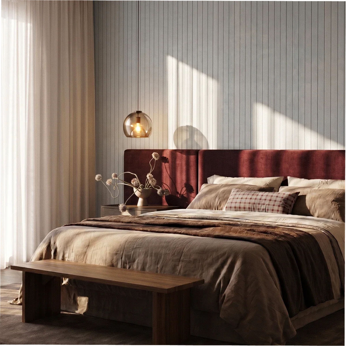 Clérachic smoked glass pendant glowing over a bedroom with a burgundy upholstered headboard and panelled wall.