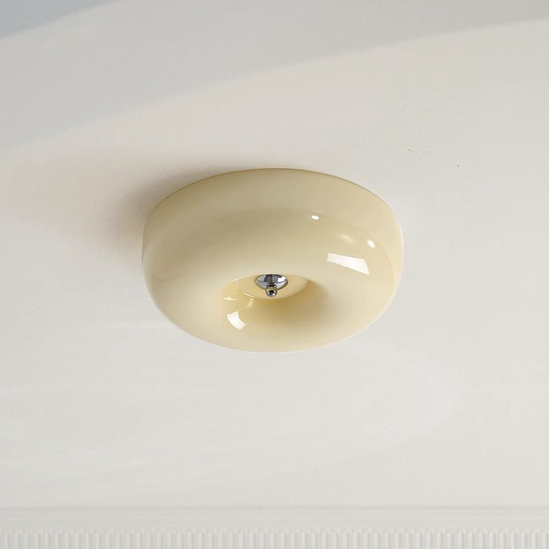 Side view of the Clérachic Domed Glass Ceiling Light on a plain ceiling, with a fluted cornice running along the wall below it.