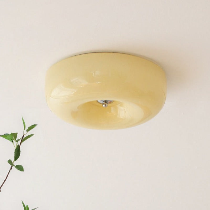 Clérachic Domed Glass Ceiling Light in cream-yellow glass, the light inside reading as an even butter glow with no visible dots.