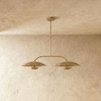 Clérachic chandelier in satin brass, front view of the two dome shades and their center rod.