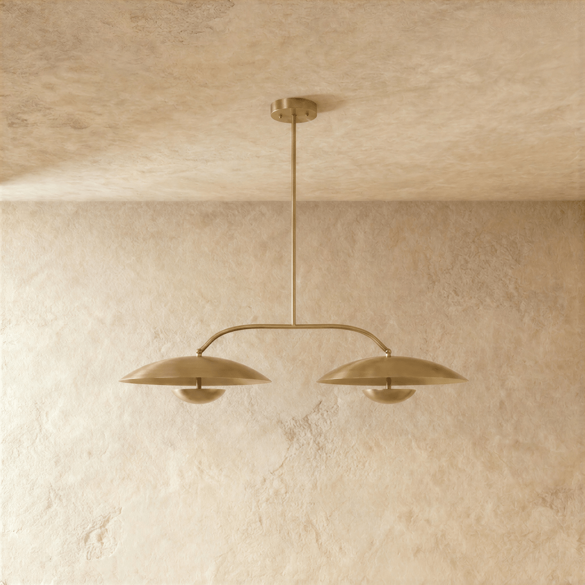 Clérachic chandelier in satin brass, front view of the two dome shades and their center rod.