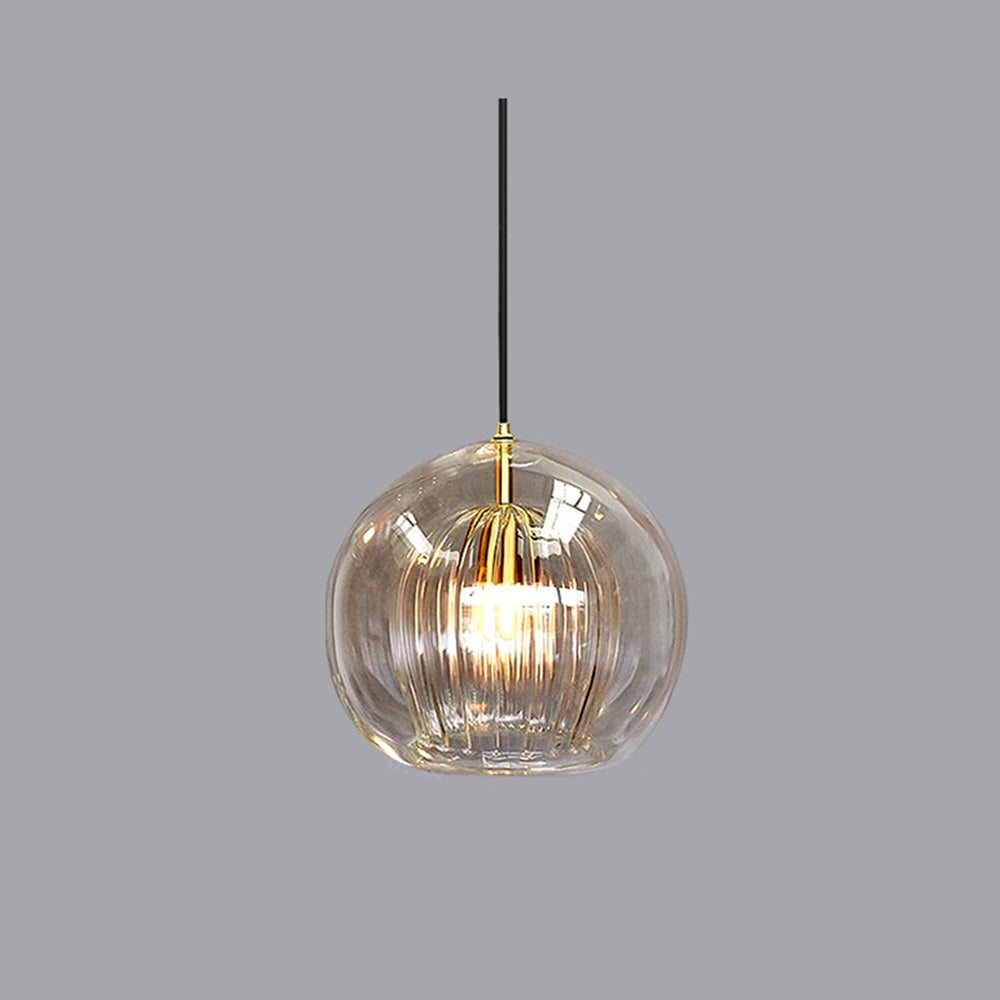Studio view of the Clérachic double-wall globe pendant on a grey ground, clear outer sphere over a brass-lit fluted inner shade.