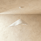 Side angle of the Clérachic textured white pendant shows its asymmetric peak and softly frayed lower edge.