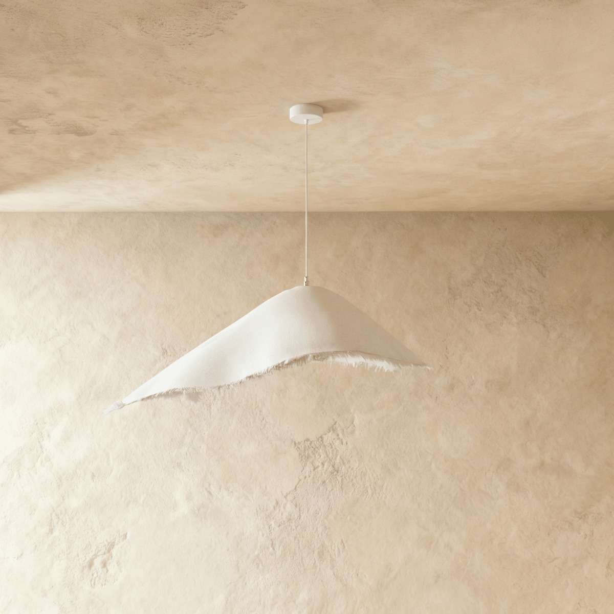 Side angle of the Clérachic textured white pendant shows its asymmetric peak and softly frayed lower edge.