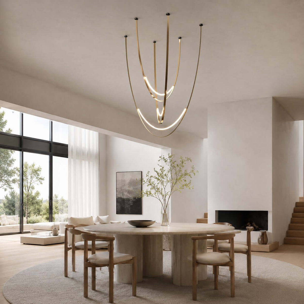 In an open room with a glazed wall and a fireplace, this Clérachic pendant on brass-toned straps hangs above a round table and wooden chairs.