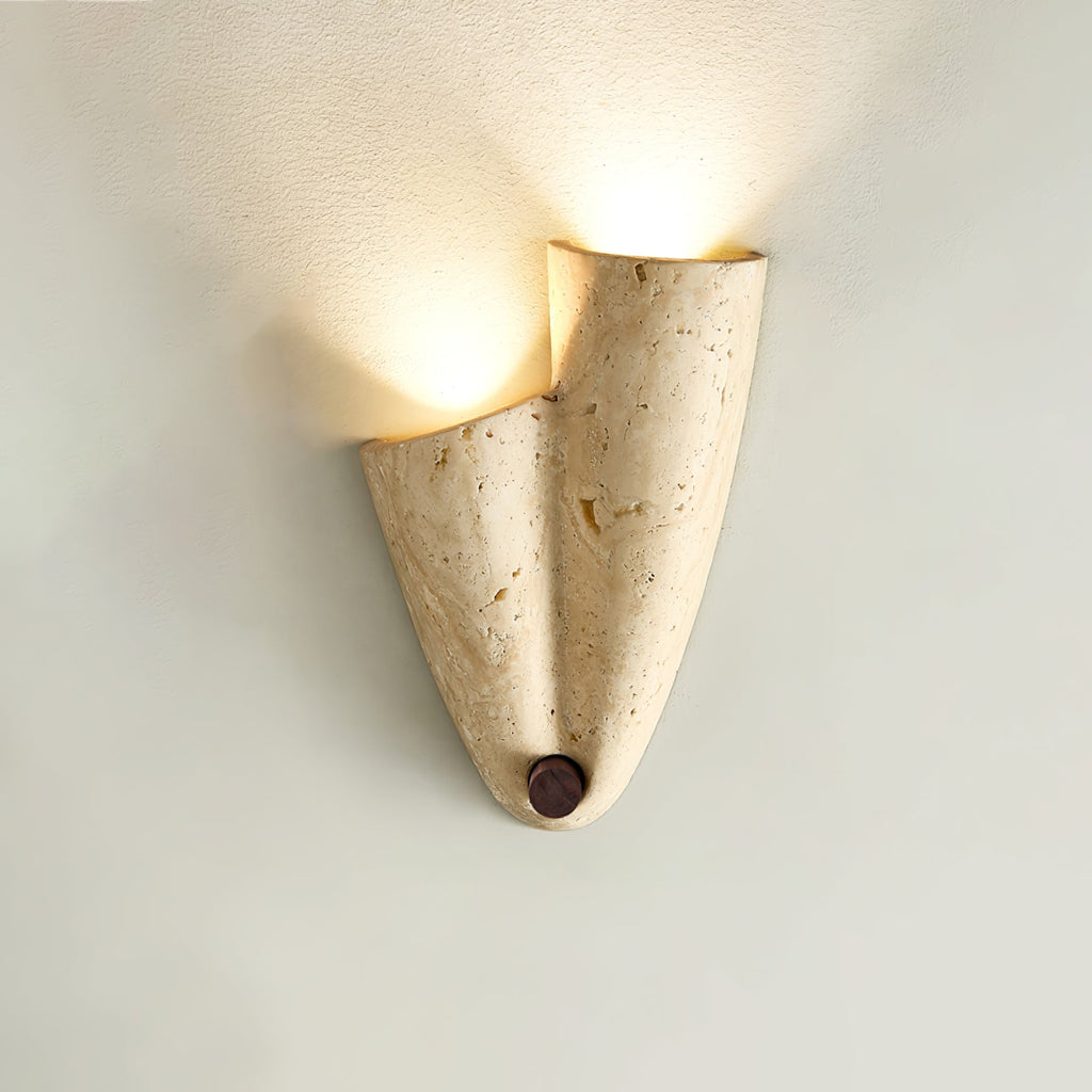 Clérachic stone wall light turned the other way up, with its glow rising from the open top and a round wood knob at the base.