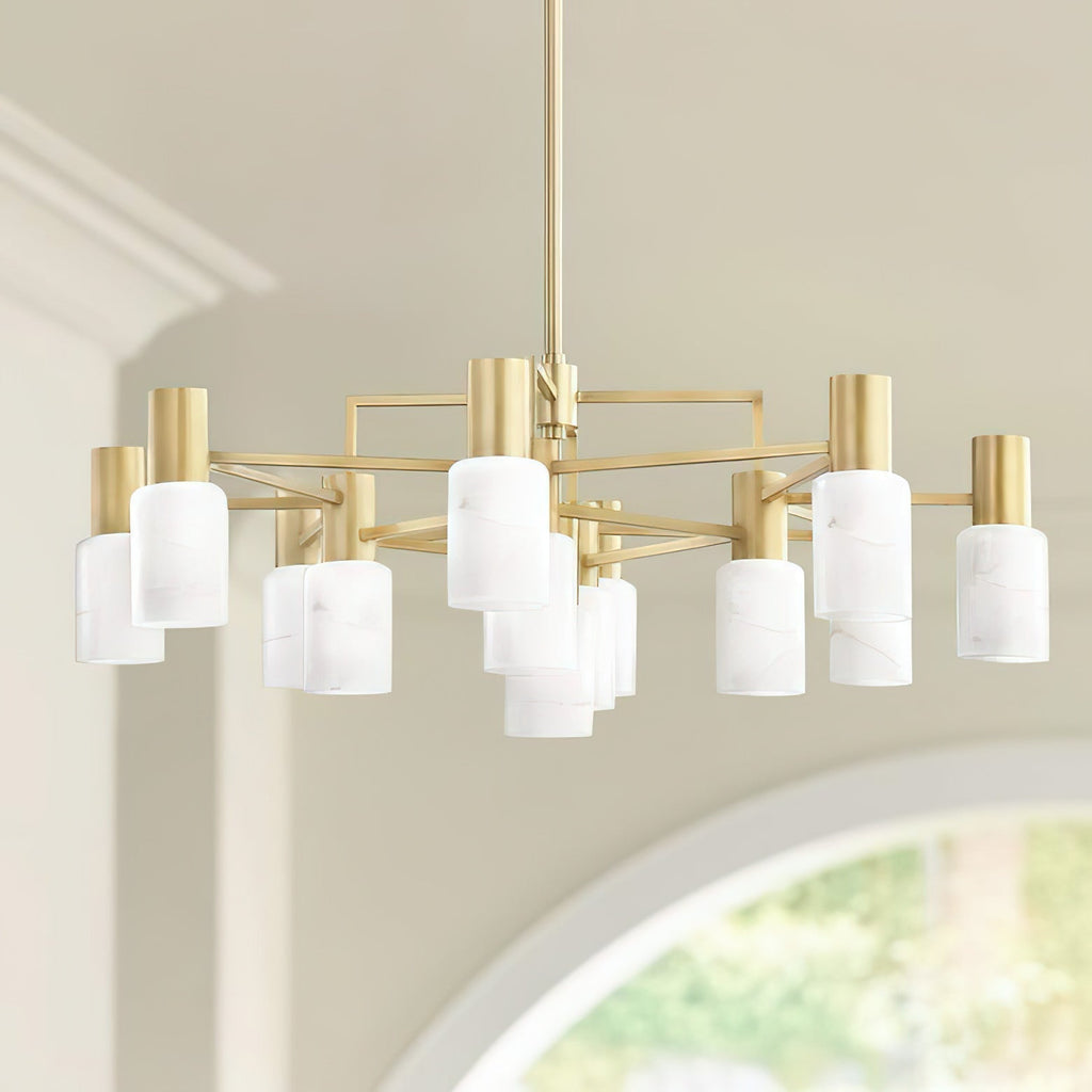 The Clérachic brass chandelier hung in a room with a coved ceiling, alabaster shades lit above an arched window.