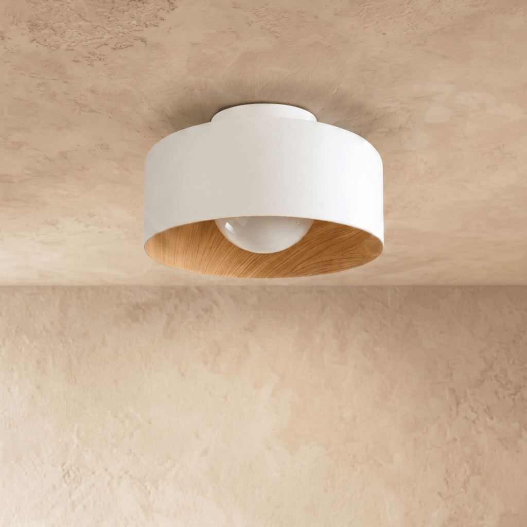 Clérachic white drum ceiling light with a wood-textured inner rim and an unlit opal acrylic ball, seen against plaster.