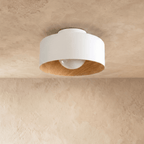 Clérachic white drum ceiling light with a wood-textured inner rim and an unlit opal acrylic ball, seen against plaster.