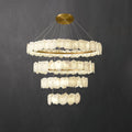 Clérachic Ecliptica chandelier on charcoal, four brass rings hung with overlapping alabaster petals.