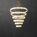 Clérachic Ecliptica chandelier in its taller build, five stacked rings of pale stone discs.