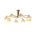 Cut-out view of a Clérachic chandelier with eight creamy glass shades on chrome arms, shown on a white background.