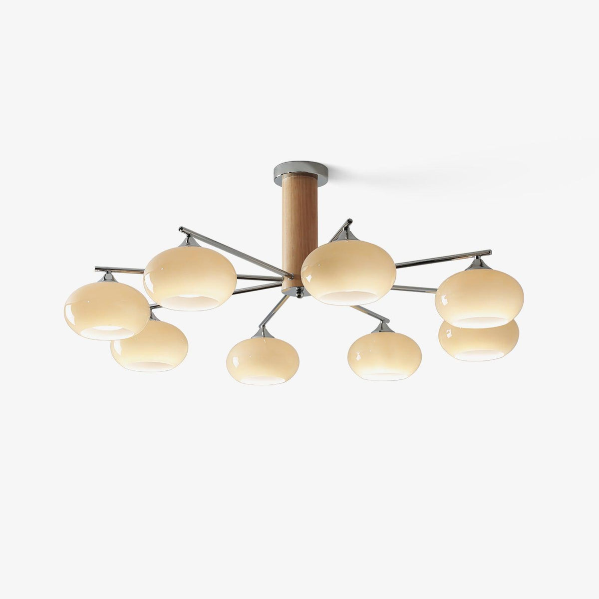 Lit chandelier from Clérachic with eight creamy yellow glass shades and chrome arms, shown on a clean pale background.