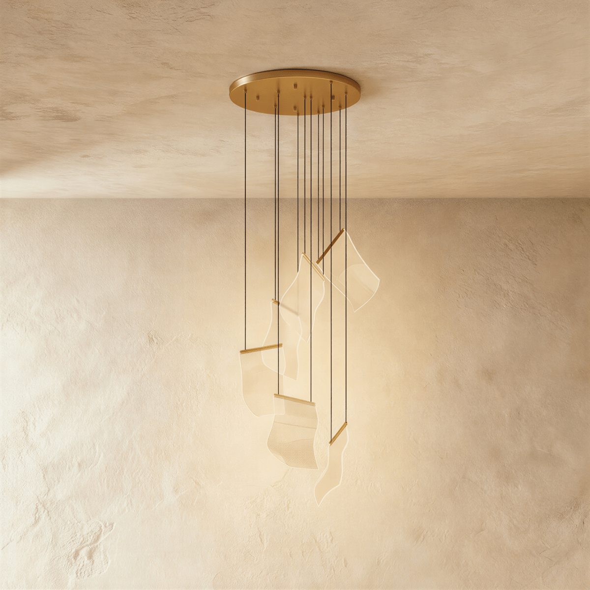 Clérachic empress gold chandelier with wavy acrylic panes suspended on fine cords from a round ceiling canopy.