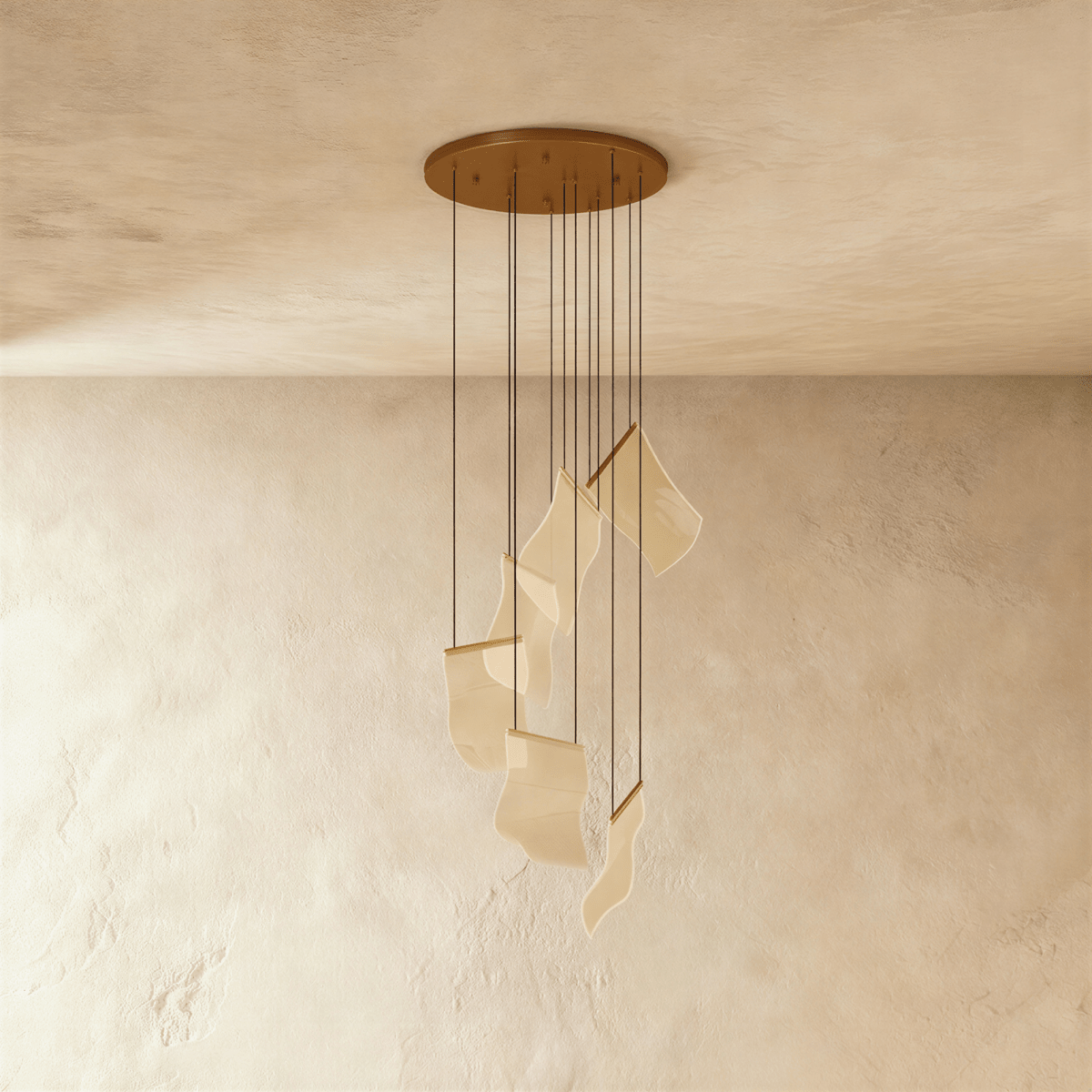 Clérachic gold-finish chandelier showing its round ceiling plate and cascading acrylic sheet pendants, unlit.