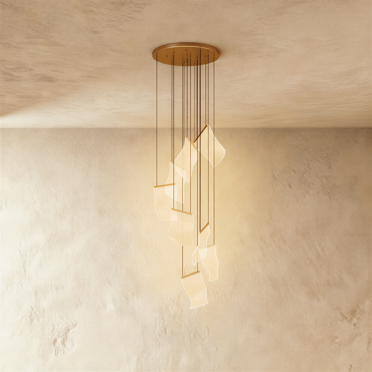 Clérachic gold chandelier with a spiral of glowing acrylic sheet pendants hanging from a brass ceiling disc.
