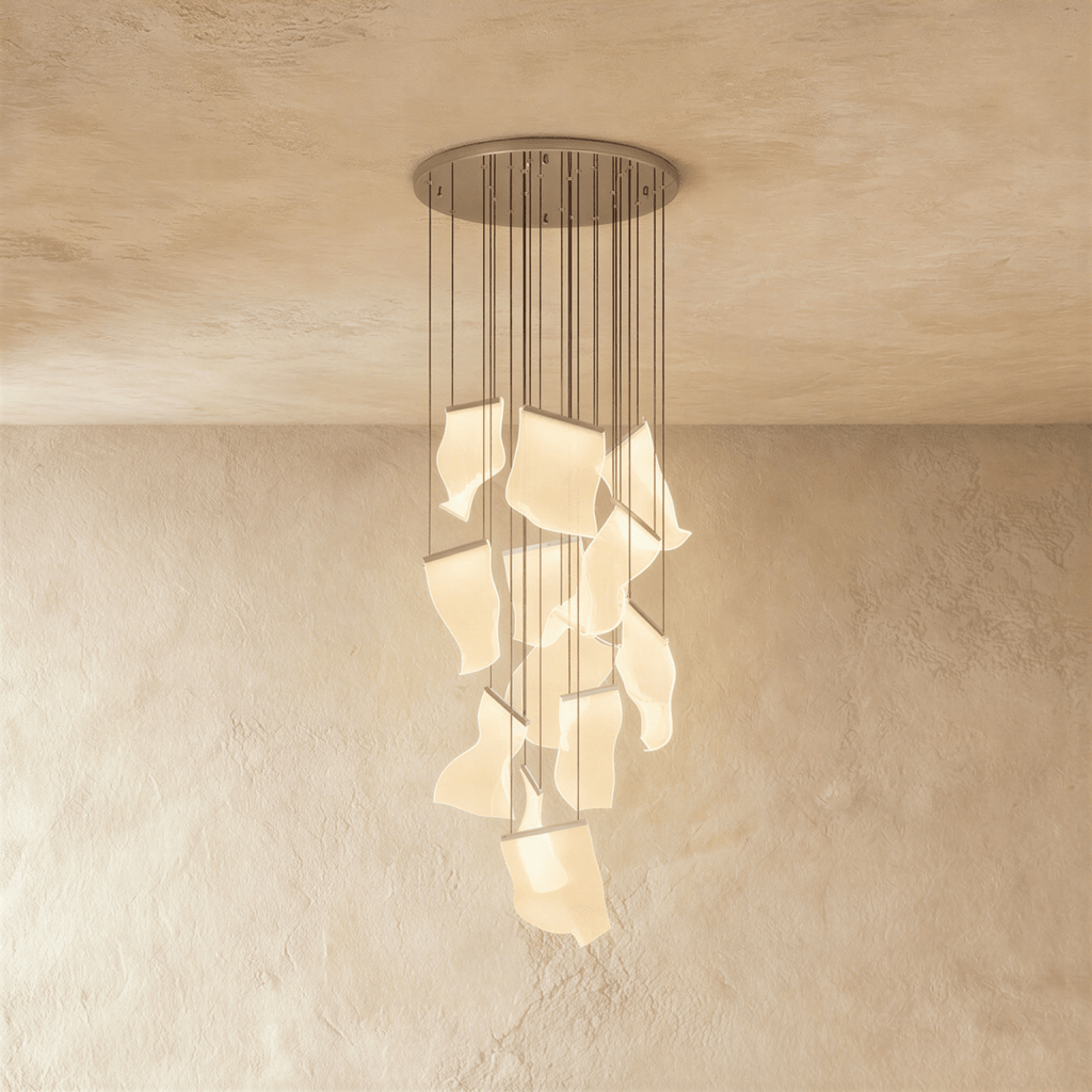 Clérachic iridium silver chandelier, a dense cluster of wavy acrylic panes glowing beneath its round ceiling plate.