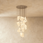 Clérachic iridium silver chandelier, a dense cluster of wavy acrylic panes glowing beneath its round ceiling plate.
