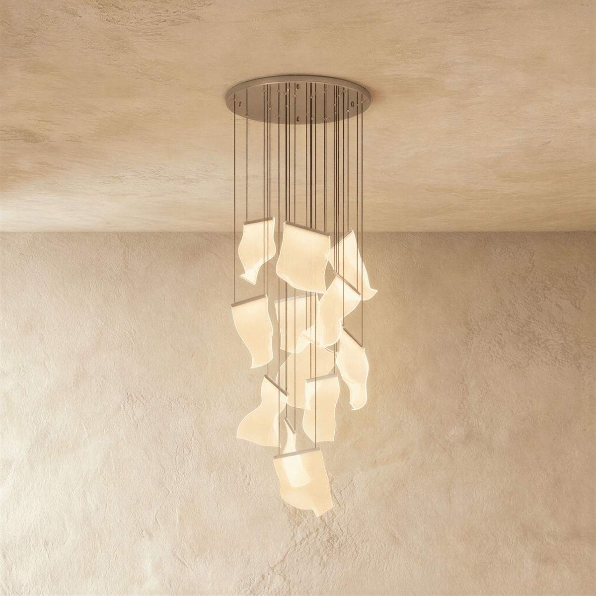 Clérachic iridium silver chandelier, a dense cluster of wavy acrylic panes glowing beneath its round ceiling plate.