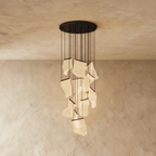 Clérachic brilliant black chandelier with a large cluster of glowing acrylic sheets suspended on fine cords.
