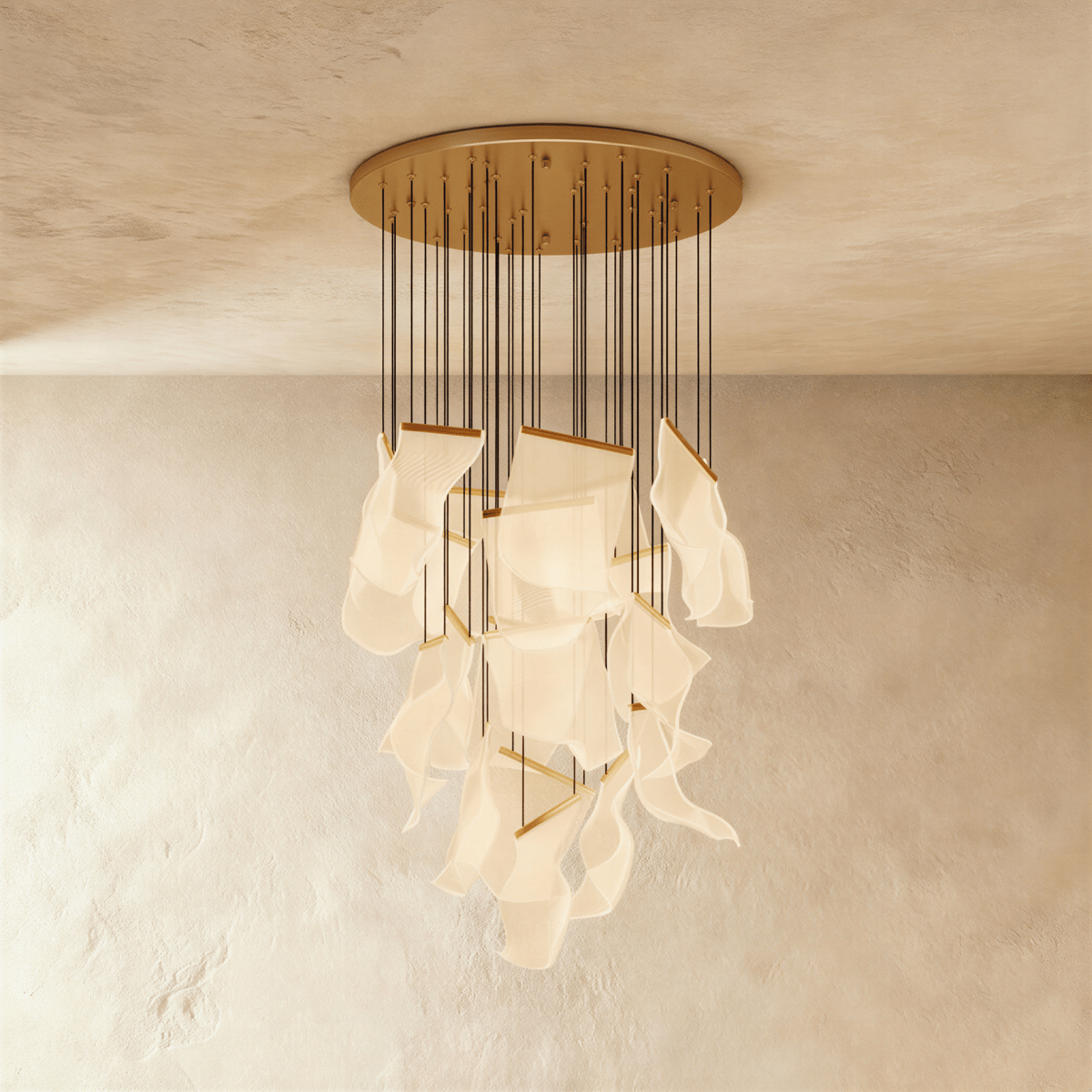 Clérachic gold chandelier with a full cascade of warm acrylic sheet panes suspended from a wide brass ceiling disc.