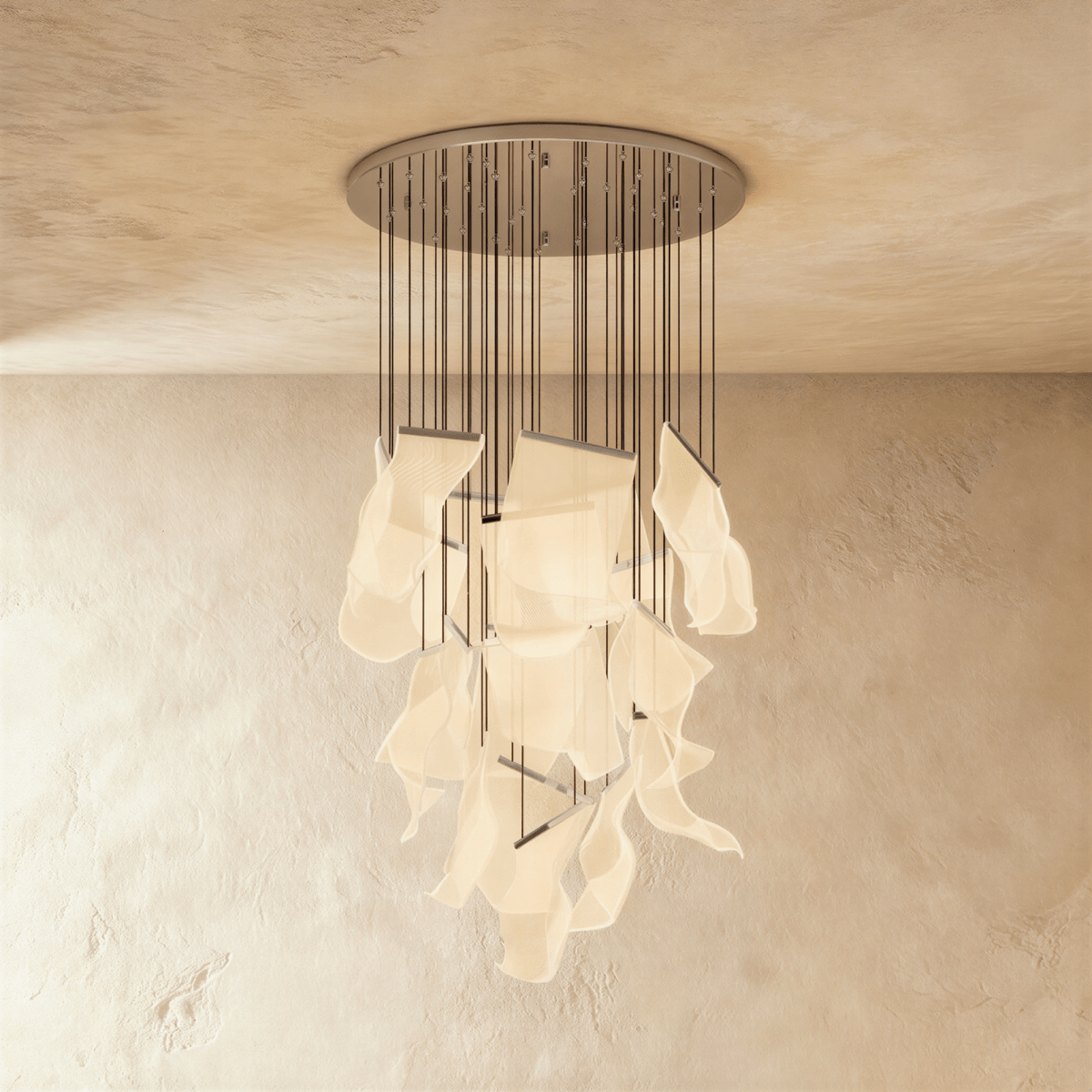 Clérachic iridium silver chandelier, its tall spiral of acrylic sheets glowing warm beneath a round ceiling plate.