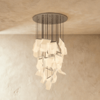 Clérachic iridium silver chandelier with an extended spiral of glowing acrylic panes below its polished ceiling disc.