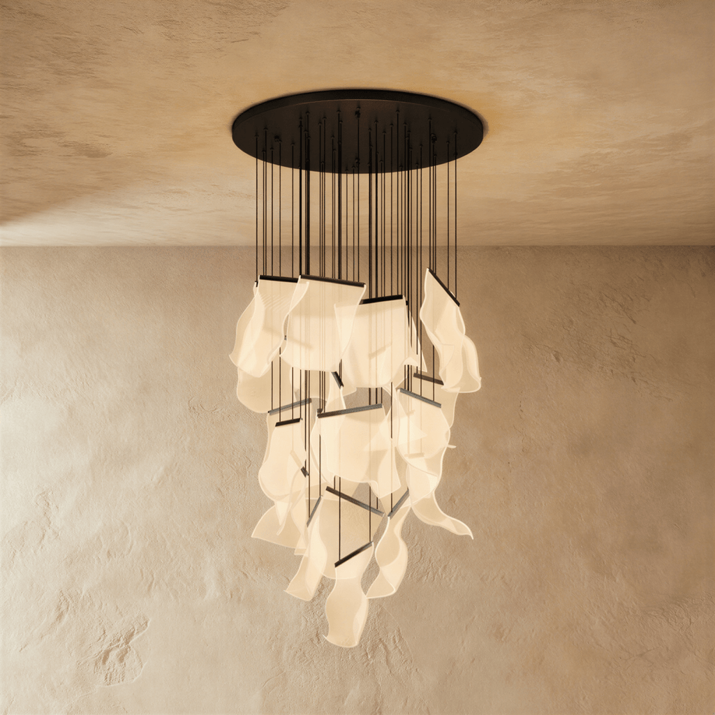 Clérachic brilliant black chandelier shown with its full cascade of glowing acrylic sheets against a plaster wall.